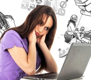 Frustrated woman staring at a laptop