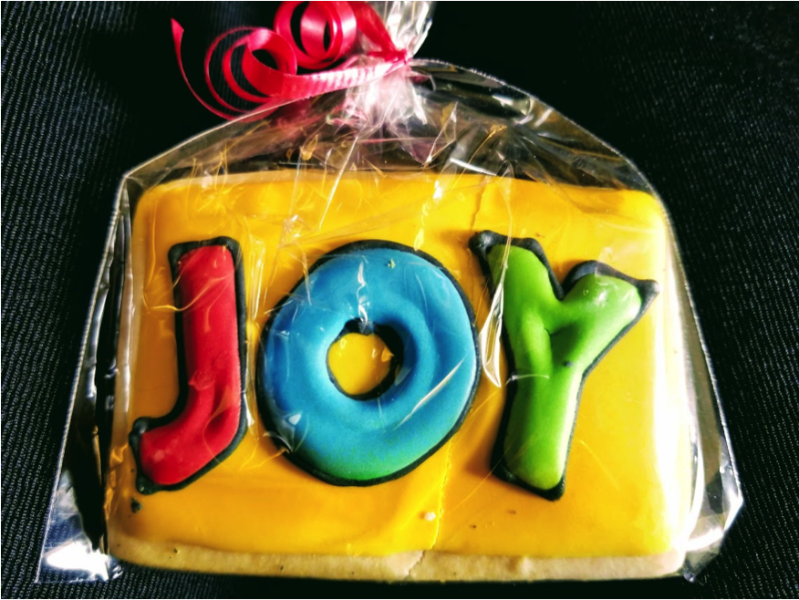 cookie with words JOY on it